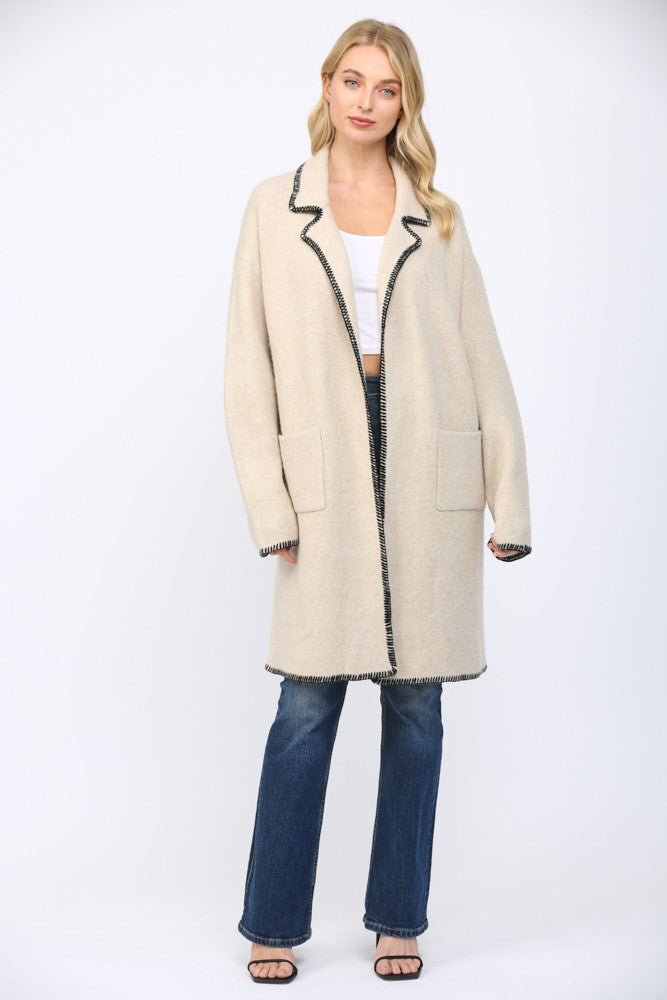 cream black trim coat sweater