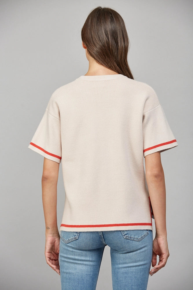 cream knit sweater top with orange stripe detail