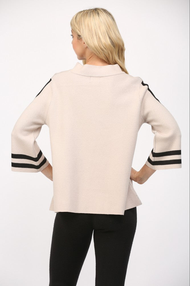 tan knit sweater with striped sleeves